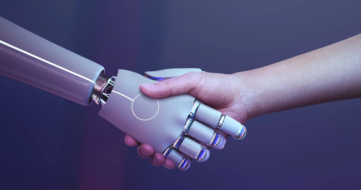 Image of a robot shacking hands with a human