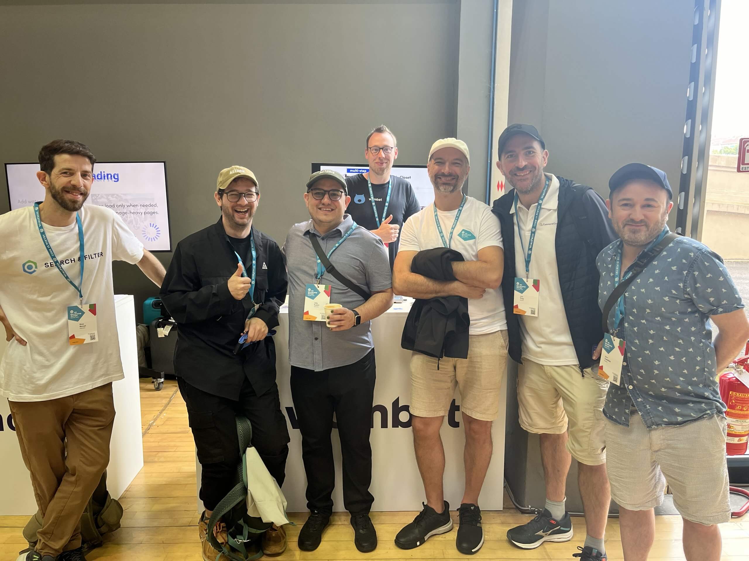 People gathering around the Wombat Plugins booth at WCEU